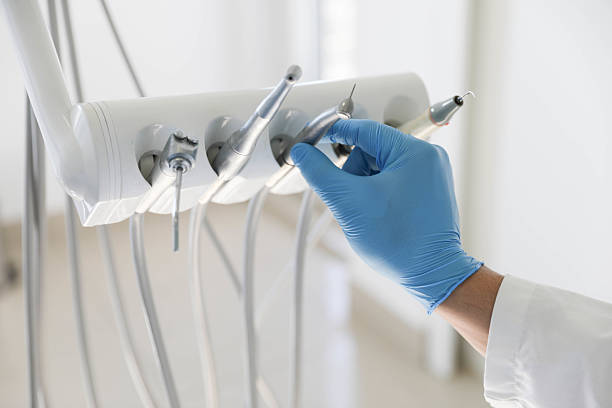 Professional Tooth Extraction technician working in Van Buren County County, MI